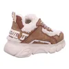 A side view of a beige and brown Buffalo sneaker with white fluffy lining. Podgląd zdjęcia produktu