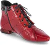 A single red boot is shown against a white background. Produktbild-Vorschau