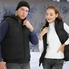 A man and a woman are posing in a snowy outdoor environment, both wearing black heated vests. Náhľad obrázku produktu