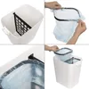 A collage of four images showing how to insert a trash bag into a dual-compartment trash can. Produktbild-Vorschau
