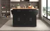 A black kitchen island with a wooden countertop is shown in a modern kitchen setting, with a large window overlooking a scenic view. Voir les images du produit