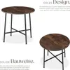 Two views of a round industrial-style table with a wood-look top and black metal legs, presented with descriptive text. Produktbild-Vorschau