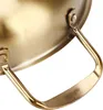 A close-up shot of the handle and side of a gold-colored pot. Produktbild-Vorschau