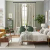 A well-decorated living room/bedroom with a bed, sofa, dining table, and curtains. Anteprima dell’immagine prodotto