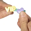 Hands holding a hair clip with the letters "VIP" and a purple heart. Podgląd zdjęcia produktu