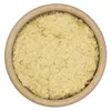 A top-down view of nutritional yeast flakes in a wooden bowl. Podgląd zdjęcia produktu