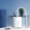 A white Ugreen USB charger plugged into a white power strip, with a white cable connected. Náhled obrázku produktu