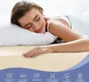 A woman sleeping peacefully on a bed with a light beige sheet. Produktbild-Vorschau