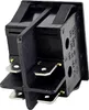 A close-up, angled view of a black electrical rocker switch with silver metal terminals. Náhľad obrázku produktu