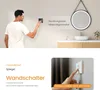 A man touching a wall switch near a mirror, with text describing the switch functionality. Anteprima dell’immagine prodotto