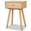 A wooden nightstand with a drawer and three legs, shown against a white background. Náhled obrázku produktu