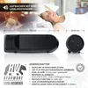 A woman is waking up in bed, with a radio alarm clock and its features displayed. Náhľad obrázku produktu