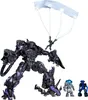 A collection of Transformers action figures, including a large purple robot with a parachute and two smaller figures. Produktbild-Vorschau