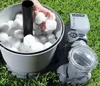 A person is adding filter balls to a pool filter system on a grassy lawn. Produktbild-Vorschau