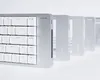 A row of silver keyboards with white keys, fading into the background. Produktbild-Vorschau