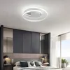 A modern bedroom with a stylish ceiling light. Produktbild-Vorschau