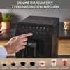A hand is shown pressing a button on a KRUPS espresso machine, with various coffee drinks displayed below. Voir les images du produit