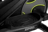 A close-up view of the pedal and flywheel housing of a black elliptical trainer. Produktbild-Vorschau