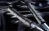 Two replica swords with black handles and silver blades are displayed on a dark, silky fabric. Podgląd zdjęcia produktu