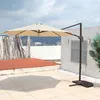 A cantilever umbrella is set up on a tiled patio with a white wall and a blue sky in the background. Produktbild-Vorschau