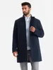 A man wearing a navy blue coat over a light blue sweater and gray pants, standing against a white background. Anteprima dell’immagine prodotto
