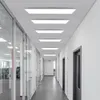A modern office hallway with multiple LED ceiling panels illuminating the space. Produktbild-Vorschau
