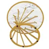 A top-down view of a round marble-patterned table with golden metal legs. Voir les images du produit