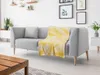 A living room scene with a gray sofa and a yellow blanket. Náhľad obrázku produktu