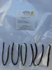 A label with product information is placed above several vanilla beans arranged in a vacuum-sealed bag. Náhľad obrázku produktu