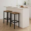 Two bar stools are placed in front of a kitchen island. Produktbild-Vorschau