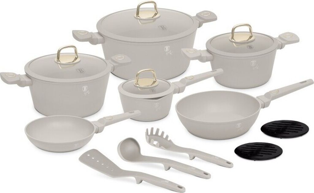 A collection of cookware and utensils arranged on a white background.