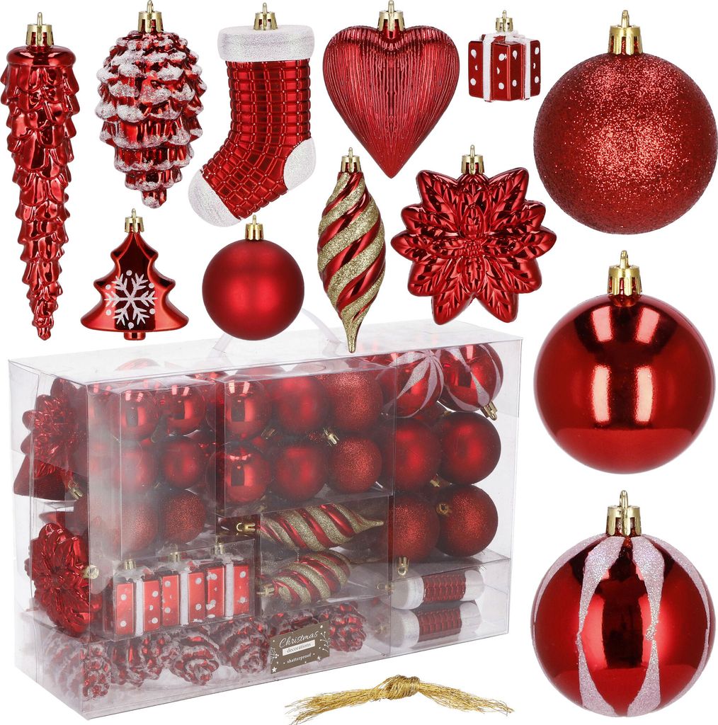 A collection of red Christmas ornaments in various shapes and sizes, displayed on a white background.