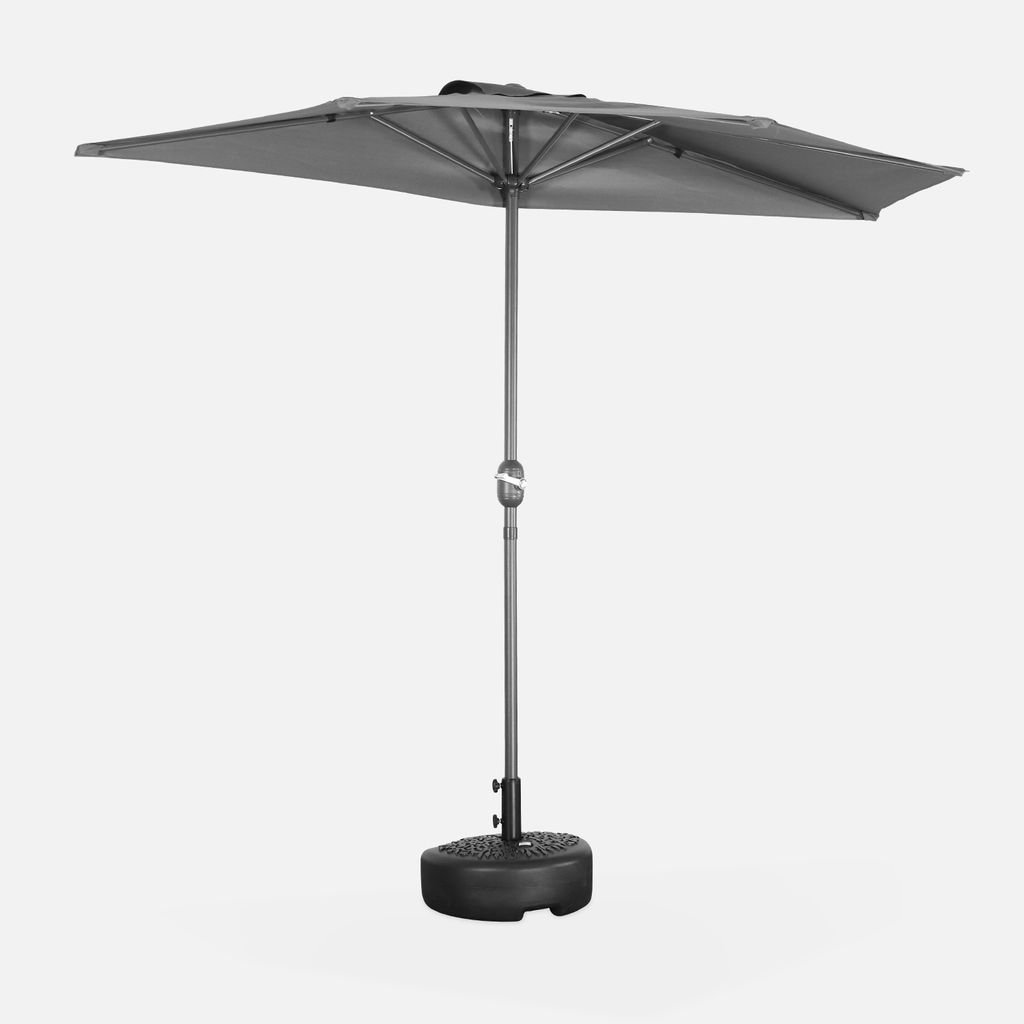 A gray rectangular patio umbrella with a central pole and a black base, isolated on a light gray background.