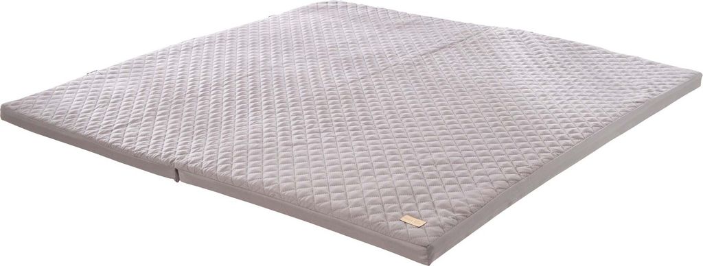 A folded mattress on a white background.
