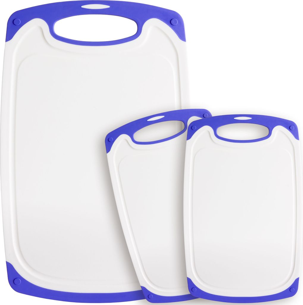 Three white cutting boards with purple trim and handles are arranged in a staggered formation against a white background.