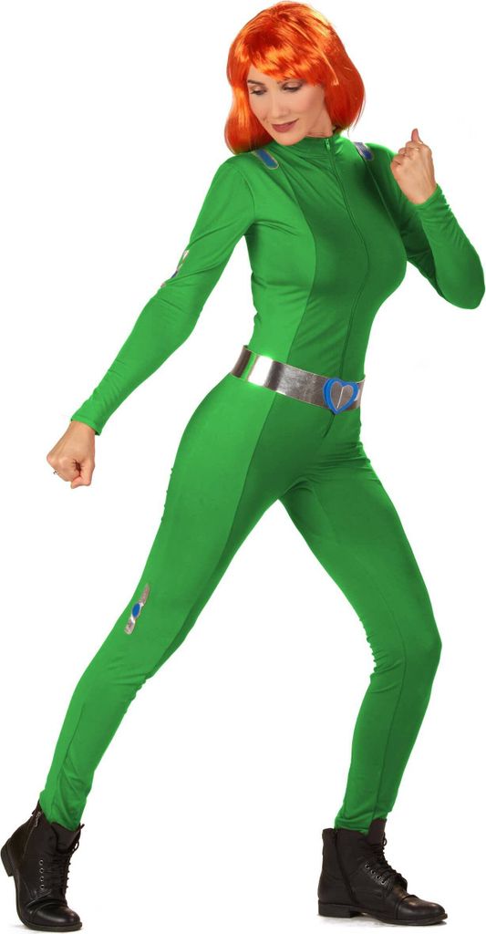 A woman in a green spy costume posing against a white background.