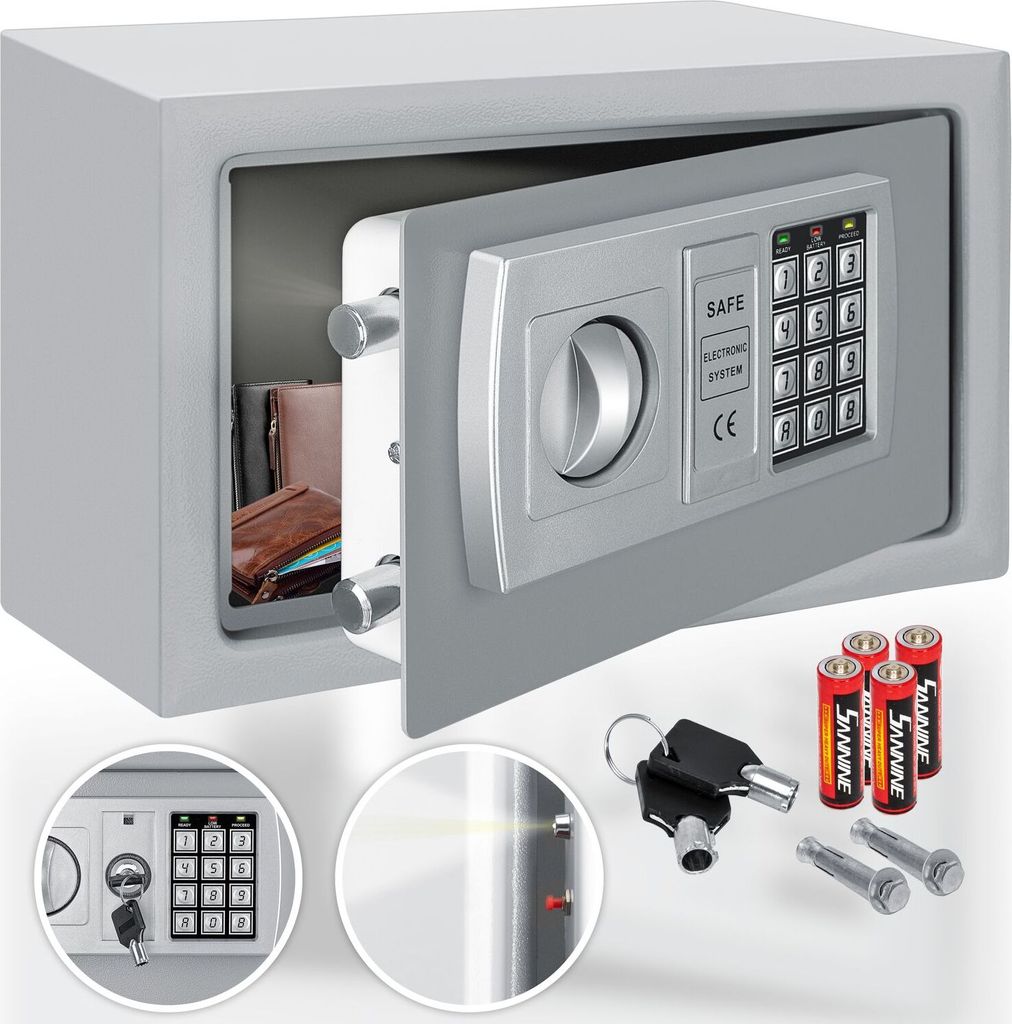 A safe with its door open, showing the interior and the electronic keypad. Accessories like batteries, keys, and mounting bolts are displayed in the foreground.