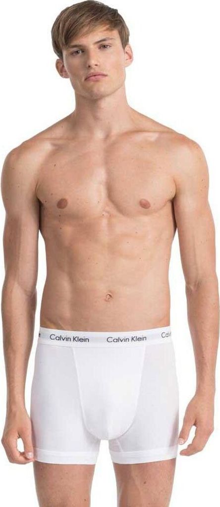 A man wearing Calvin Klein boxer briefs.