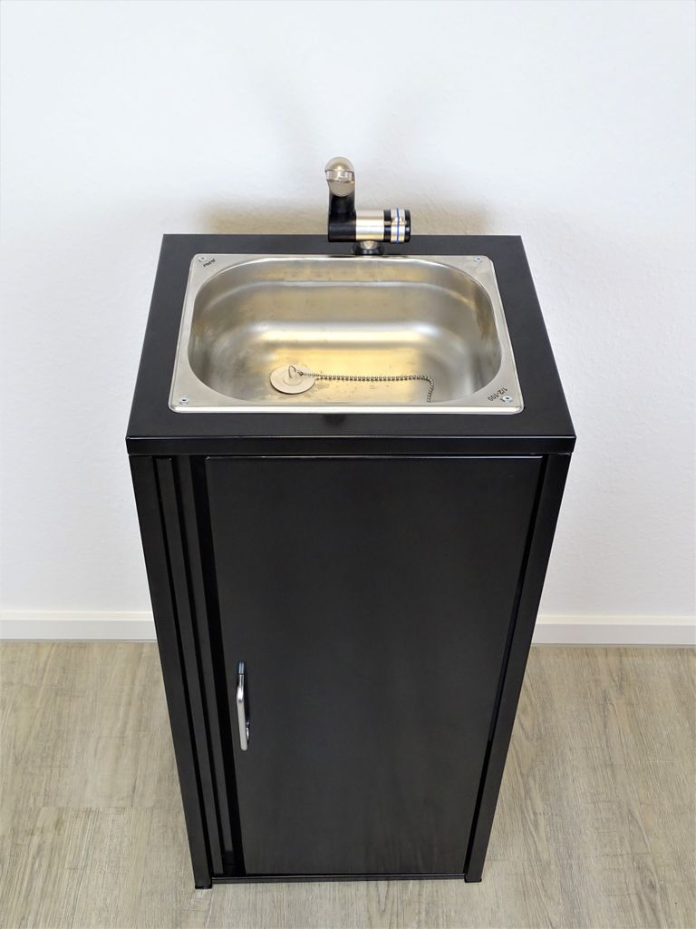 A black cabinet with a stainless steel sink and faucet on top, set against a white wall.
