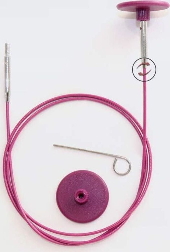 A knitting cable and accessories are laid out on a white background.