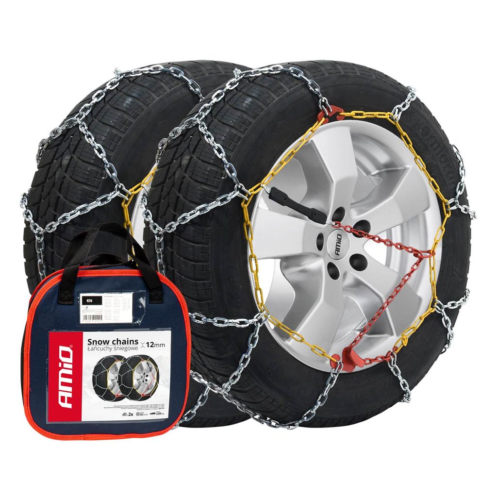 A pair of snow chains on car tires, with a storage bag in the foreground.