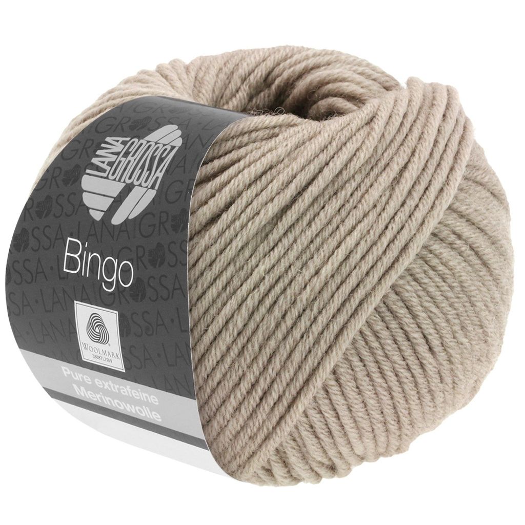 A ball of beige yarn with a dark gray label.