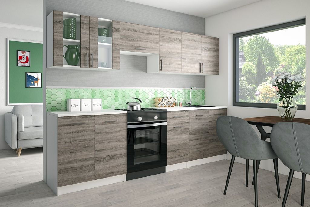 A modern kitchen with light gray cabinets and a white countertop, featuring a stovetop and oven.