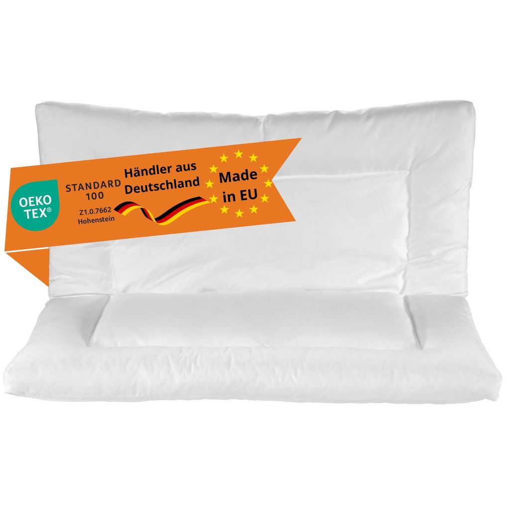 A white pillow with an orange banner overlay.
