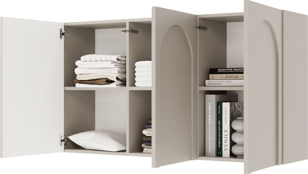 A close-up view of an open gray sideboard with white doors, revealing shelves with folded towels, a pillow, and books.