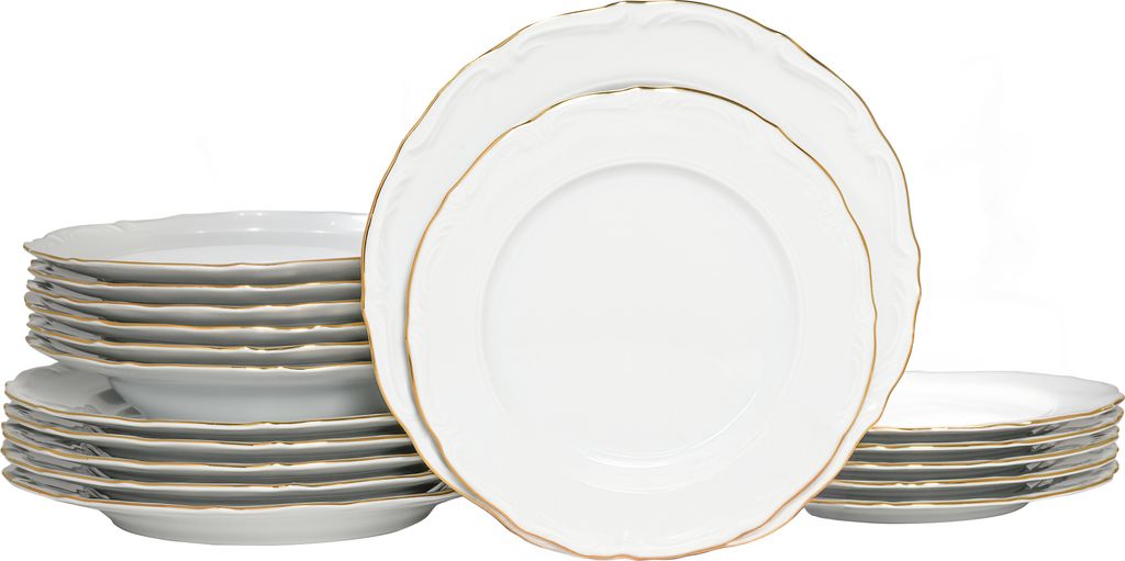 A stack of white plates with gold trim against a white background.