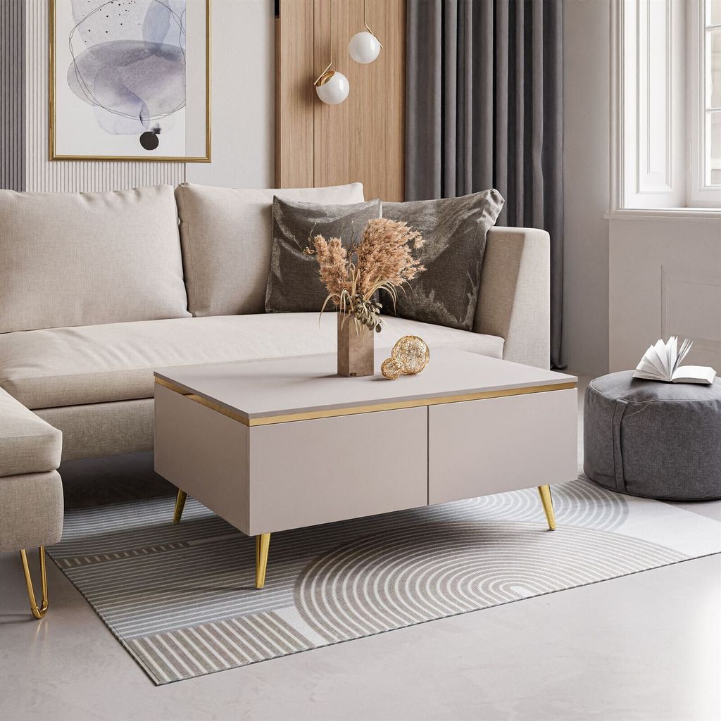 A modern living room scene featuring a couch, coffee table, and ottoman.