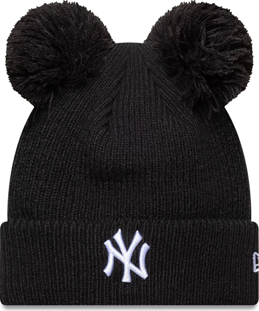A black New York Yankees beanie with two pom-poms on top and the team logo embroidered on the front.