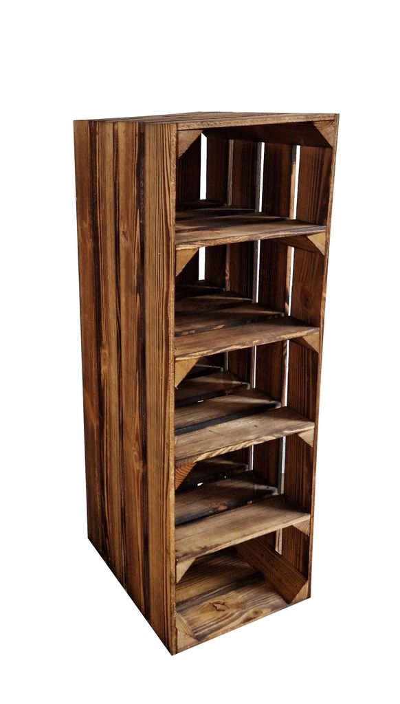 A tall, narrow wooden shelving unit made of stacked crates, displaying five open shelves.
