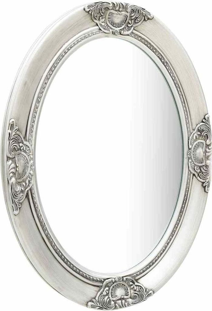 A silver oval mirror with ornate baroque-style detailing on the frame, presented against a white background.